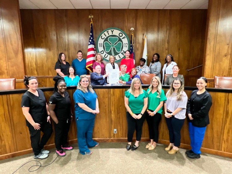 Group of Nurses smiling with the Mayor