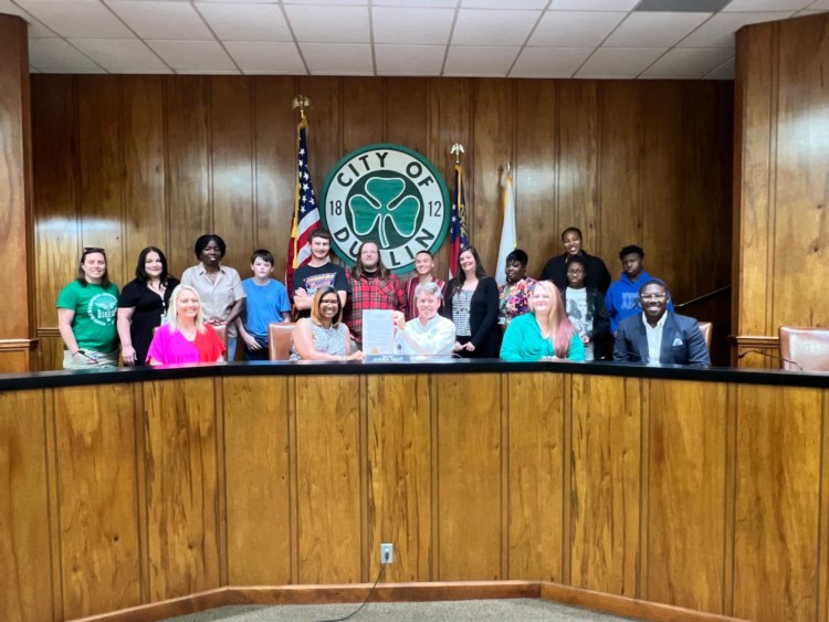 Mental Health Professionals smiling with the Mayor.